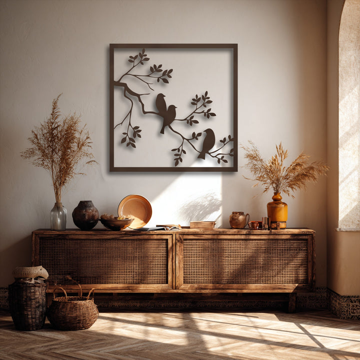 An abstract metal wall art decoration showcases minimalist bird and branch silhouettes framed, creating a serene and modern focal point.