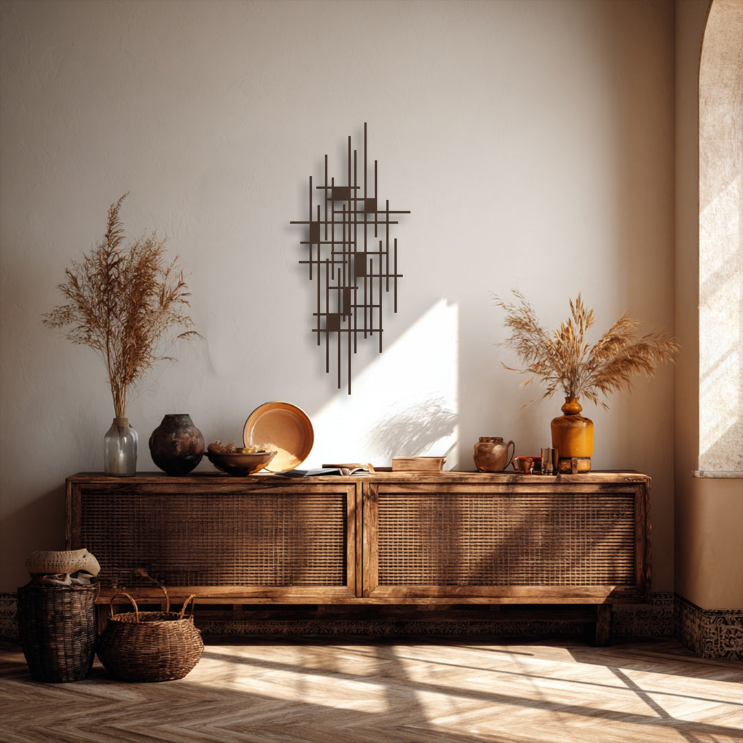 Vertically arranged abstract geometric metal wall decor, featuring a complex interplay of thin bars and small rectangular shapes.