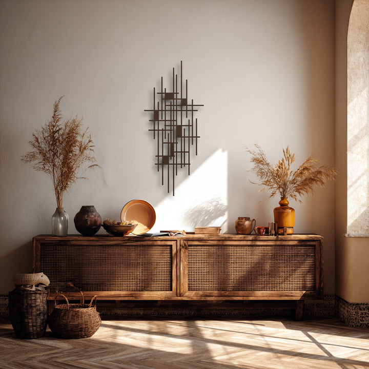 Vertically arranged abstract geometric metal wall decor, featuring a complex interplay of thin bars and small rectangular shapes.