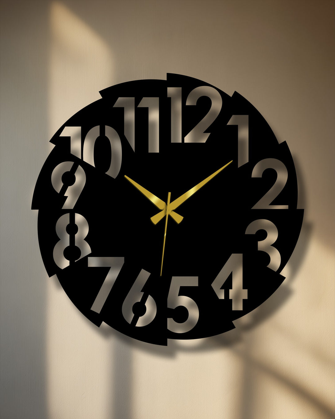 Sunlight illuminates the contemporary numbers on this decorative metal art piece, a large modern split number metal wall clock with gold hands.