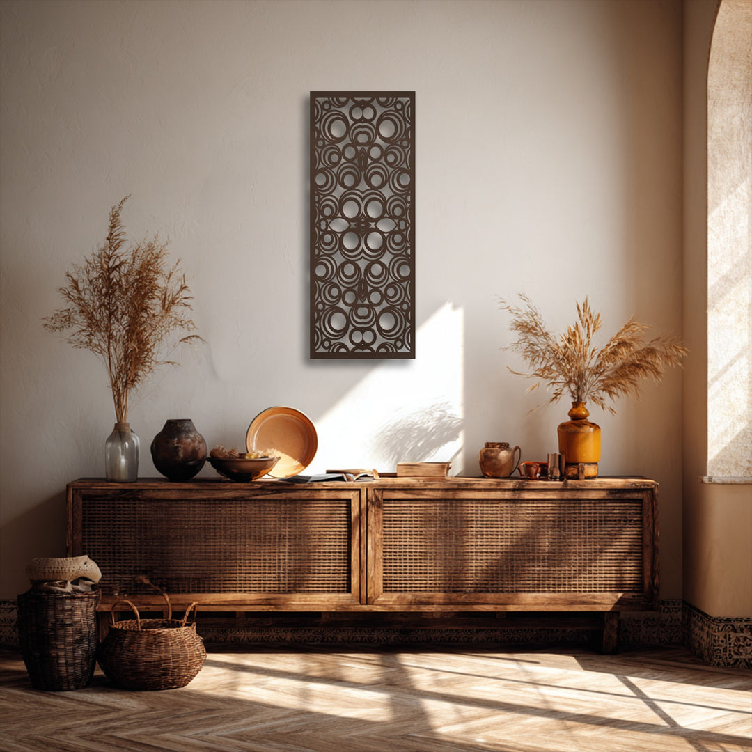 The stillness of the minimalist space is emphasized by the striking geometric circle pattern metal wall decor.