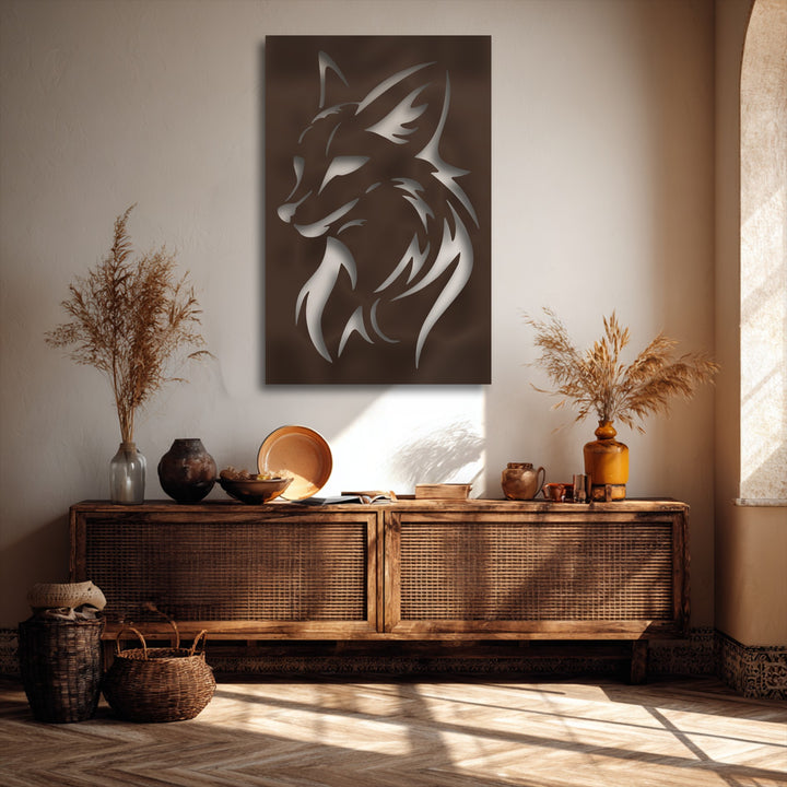 A cozy, warm color temperature enhances the intricate decorative metal art of a fierce wolf head silhouette in an earthy-toned setting.