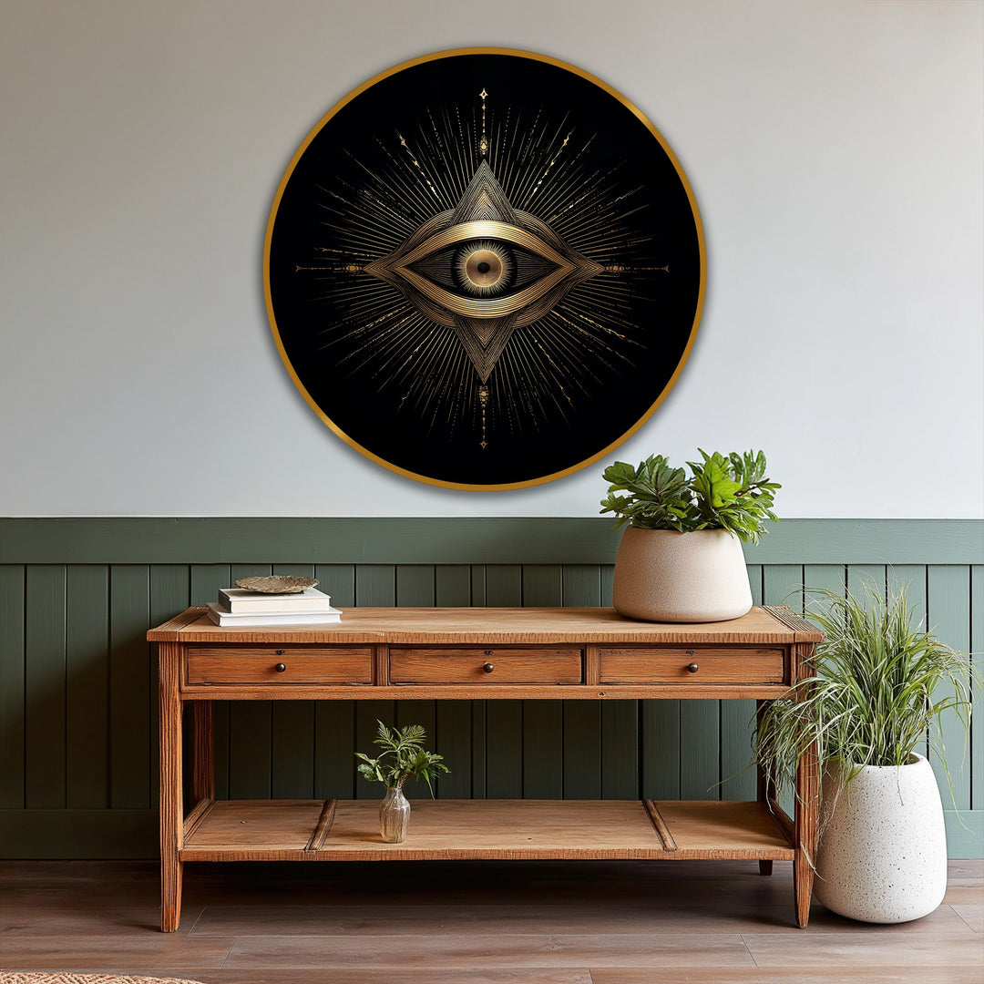 Featuring a gold edge, this round oil painting art piece displays a radiant, geometric sacred eye design with intricate golden rays on a black background.
