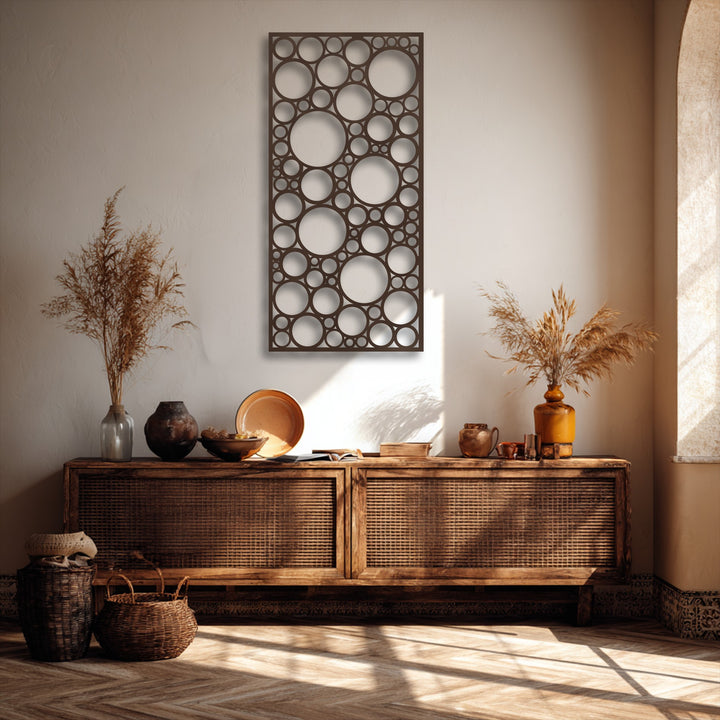 Dynamic play of light and shadow highlights the intricate circular design of the abstract metal art for wall, enhancing its visual depth.