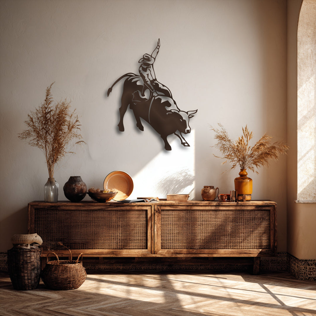 The dynamic action of a rodeo cowboy on a bucking bull is dramatically captured in this decorative metal art.