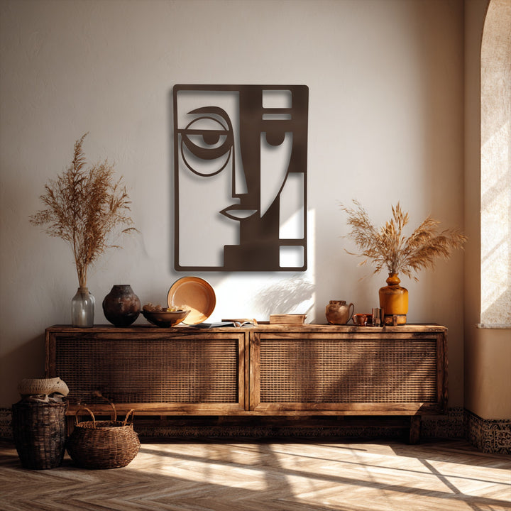 This durable dark bronze metal art for wall features an abstract geometric face with precision cut details, highlighting superior material quality.