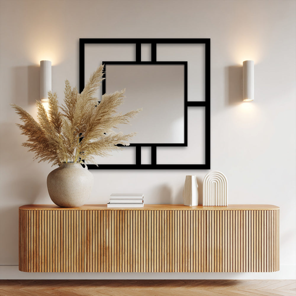A close-up of the decorative pampas grass in a ceramic vase highlights the textures complementing the modern square framed balance stained glass wall mirror.
