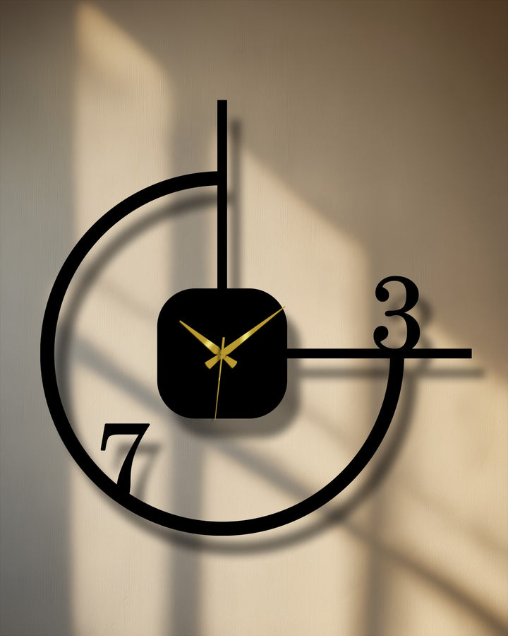 Negative space defines the minimalist geometric metal artwork clock with abstract circle decor, creating a visually striking and modern wall accent.