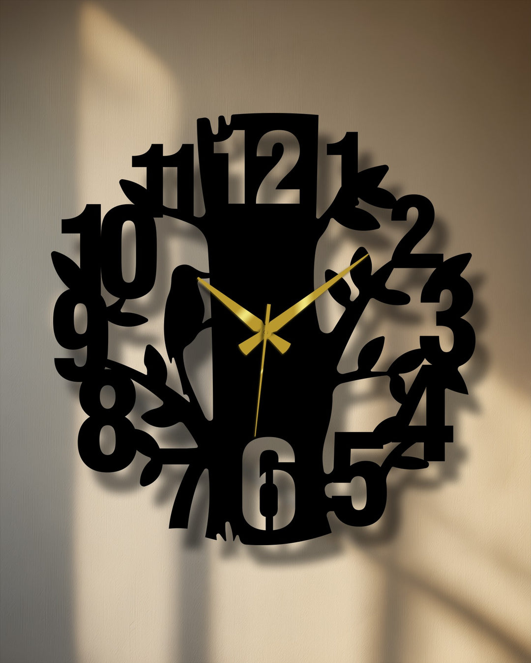 Horizontally oriented round nature tree design modern metal wall clock features a unique metal wall art design with bold numbers and decorative gold hands.