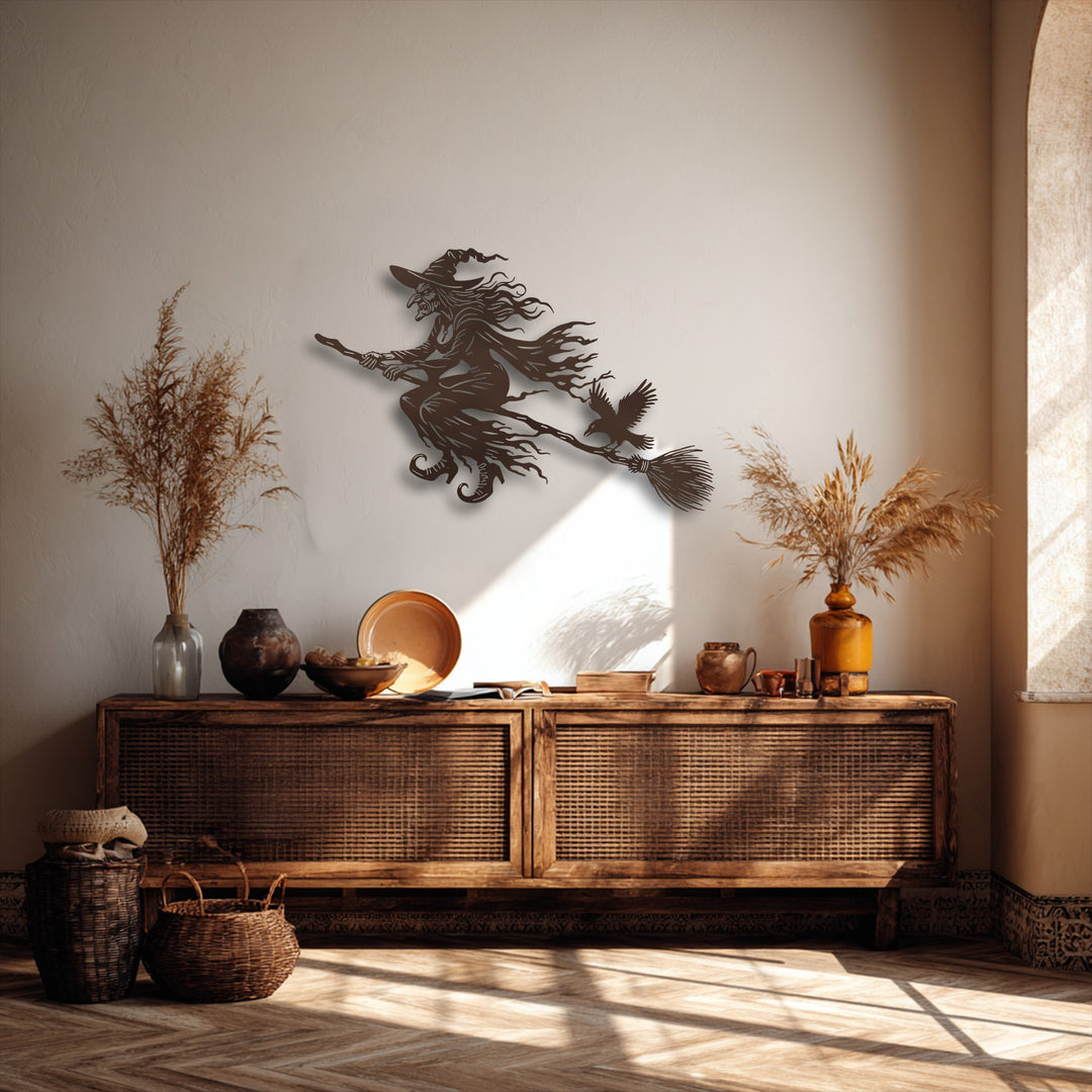 Sunlight casts striking light and shadow on the detailed flying witch metal decoration wall art, enhancing its spooky Halloween allure.