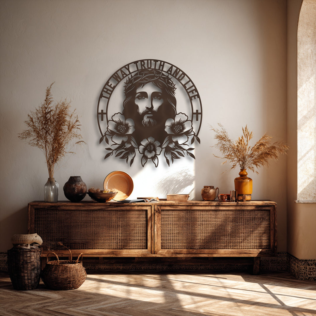The smooth, intricate surface texture of the Sacred Jesus metal wall decor stands out against the subtly textured wall and natural wood.