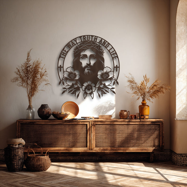 The smooth, intricate surface texture of the Sacred Jesus metal wall decor stands out against the subtly textured wall and natural wood.