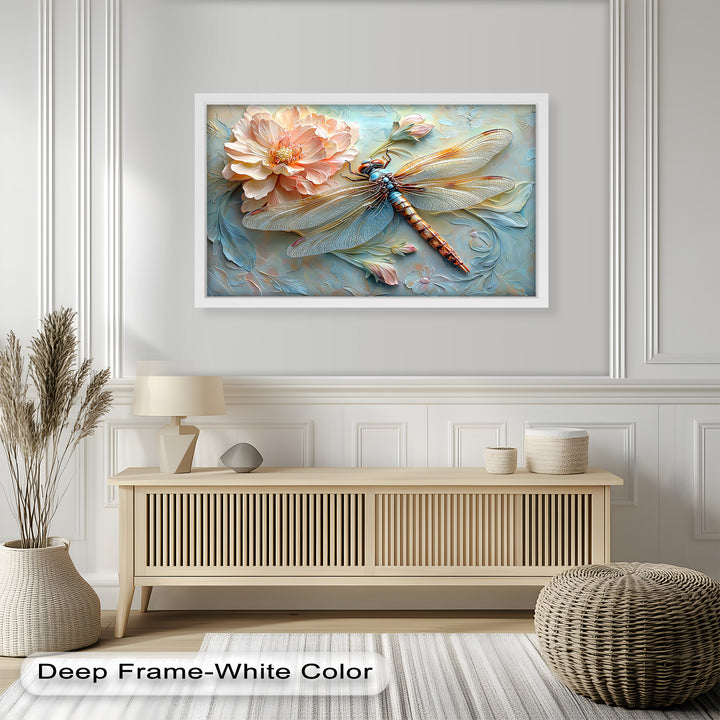 A sophisticated framed wall art piece featuring a vibrant dragonfly in shades of gold, blue, and bronze, set against a dreamy floral background with sculptural detailing.