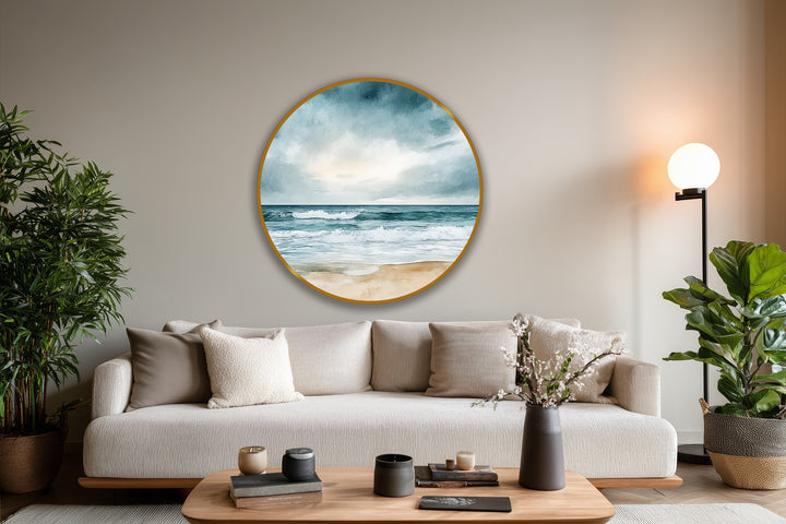 Layered depth is achieved in this coastal scene in the round oil painting artwork featuring a beach horizon with breaking waves and soft, clouded sky.
