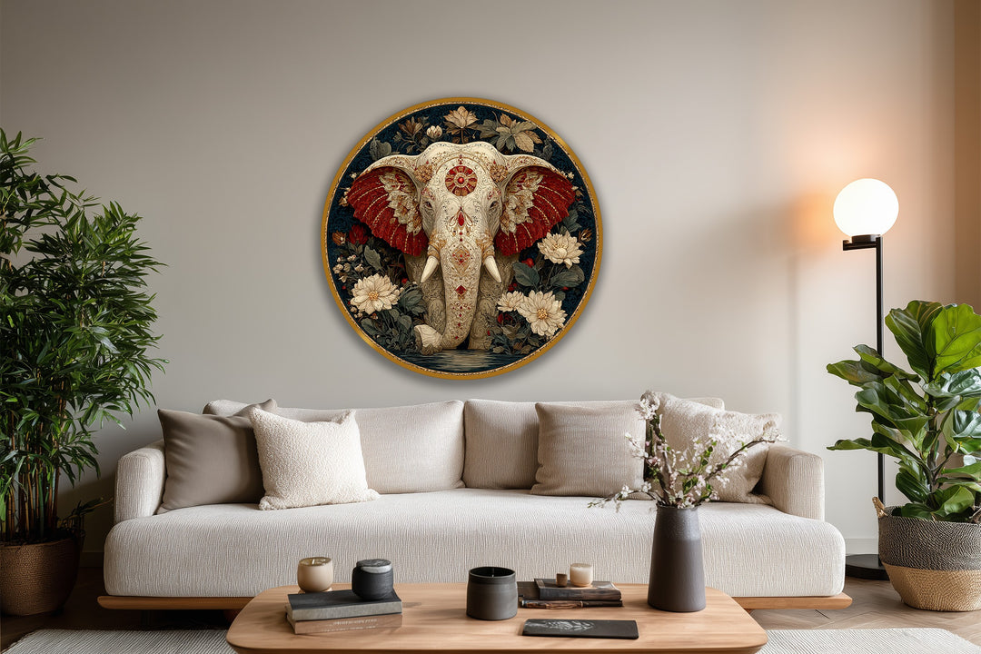 A soft gray background complements the ornamental round oil painting decoration, featuring a sacred elephant on wood with crimson ears and detailed floral art.