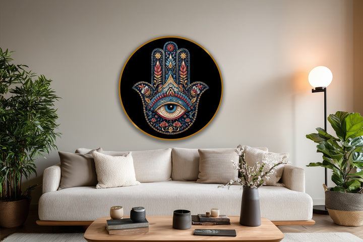 Defining the ornate border, the round oil painting art piece features a golden edge highlighting a Hamsa hand with a protective eye in vibrant, folkloric details.