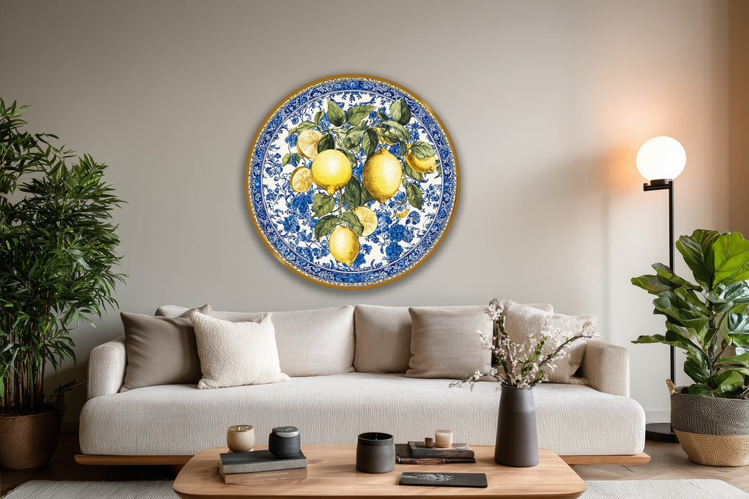 Subtle light and shadow play enhances the Mediterranean freshness of this round oil painting home decor featuring vibrant lemons and blue floral patterns.
