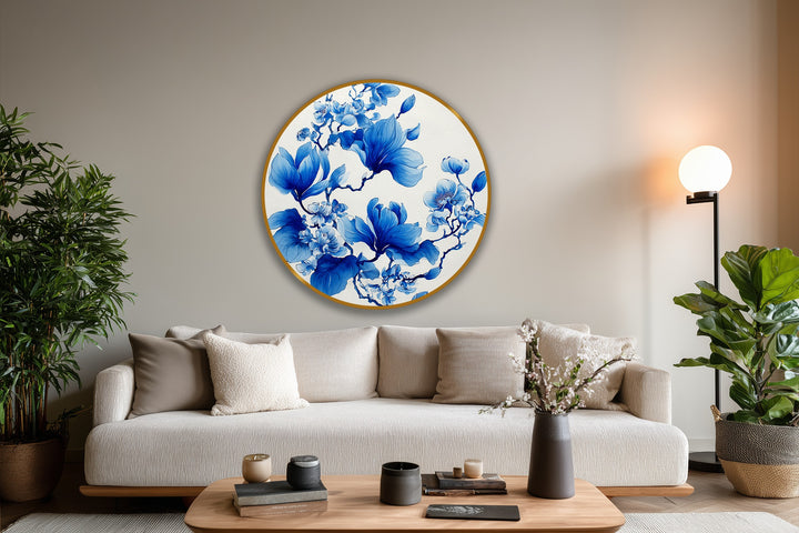 High color contrast showcases the elegant blue magnolia blossoms in this round oil painting decoration, contrasting against the neutral backdrop and warm-toned accents.