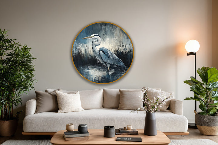 Depicting the background's blurred, moody tones, the round oil painting art piece showcases a heron amidst abstract textures and cool, muted wildlife hues.