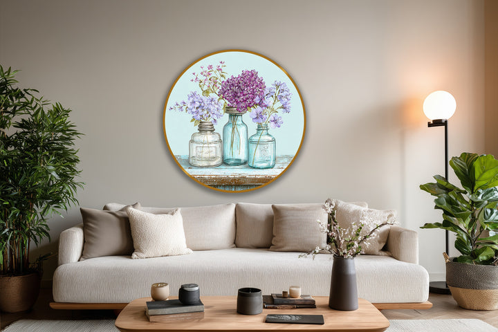 Circular oil painting home decor features a golden-edged frame enclosing three vintage jars with wildflowers, emphasizing round and rectangular geometric elements.