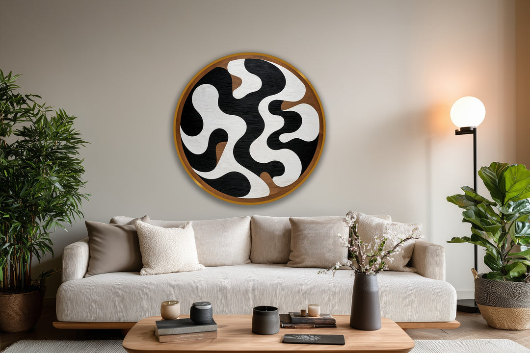 Negative space is emphasized in this round, abstract monochrome flow oil painting art piece, where black and white shapes create a dynamic contrast in this modern artwork.