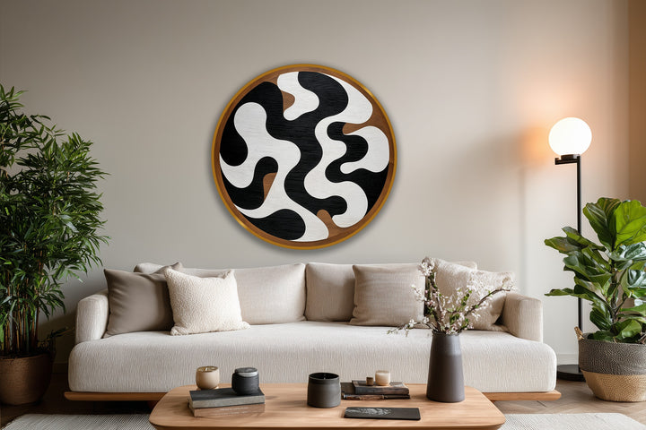 Negative space is emphasized in this round, abstract monochrome flow oil painting art piece, where black and white shapes create a dynamic contrast in this modern artwork.