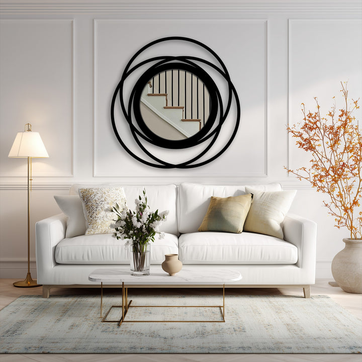 Featuring intertwined rings in a geometric design, this modern wall mirrors floor mirror presents a bold, circular statement with its layered black metal frame.