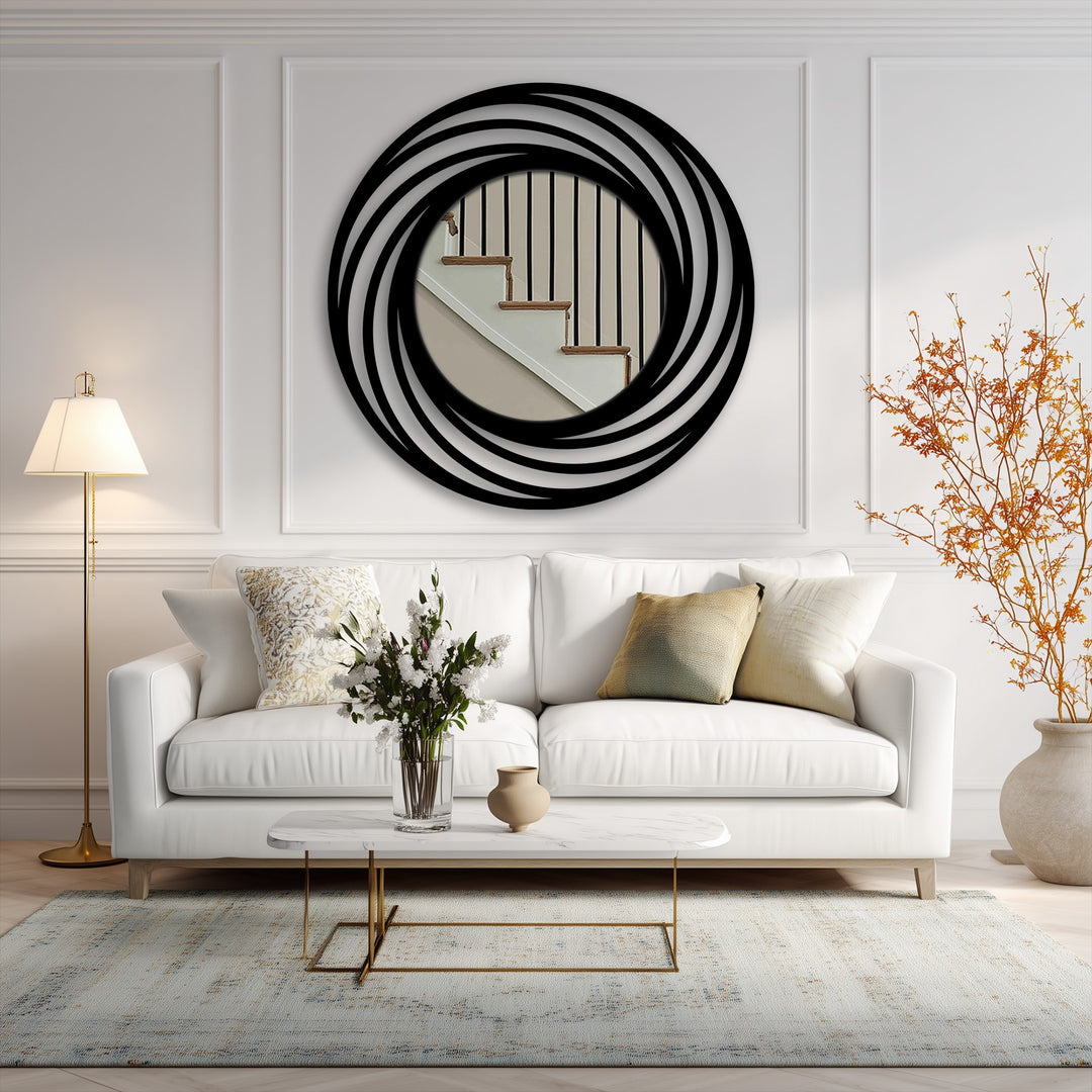 Geometric swirling rings in black metal create a focal point as decorating with wall mirrors enhances the modern circle floor mirror's reflective qualities.