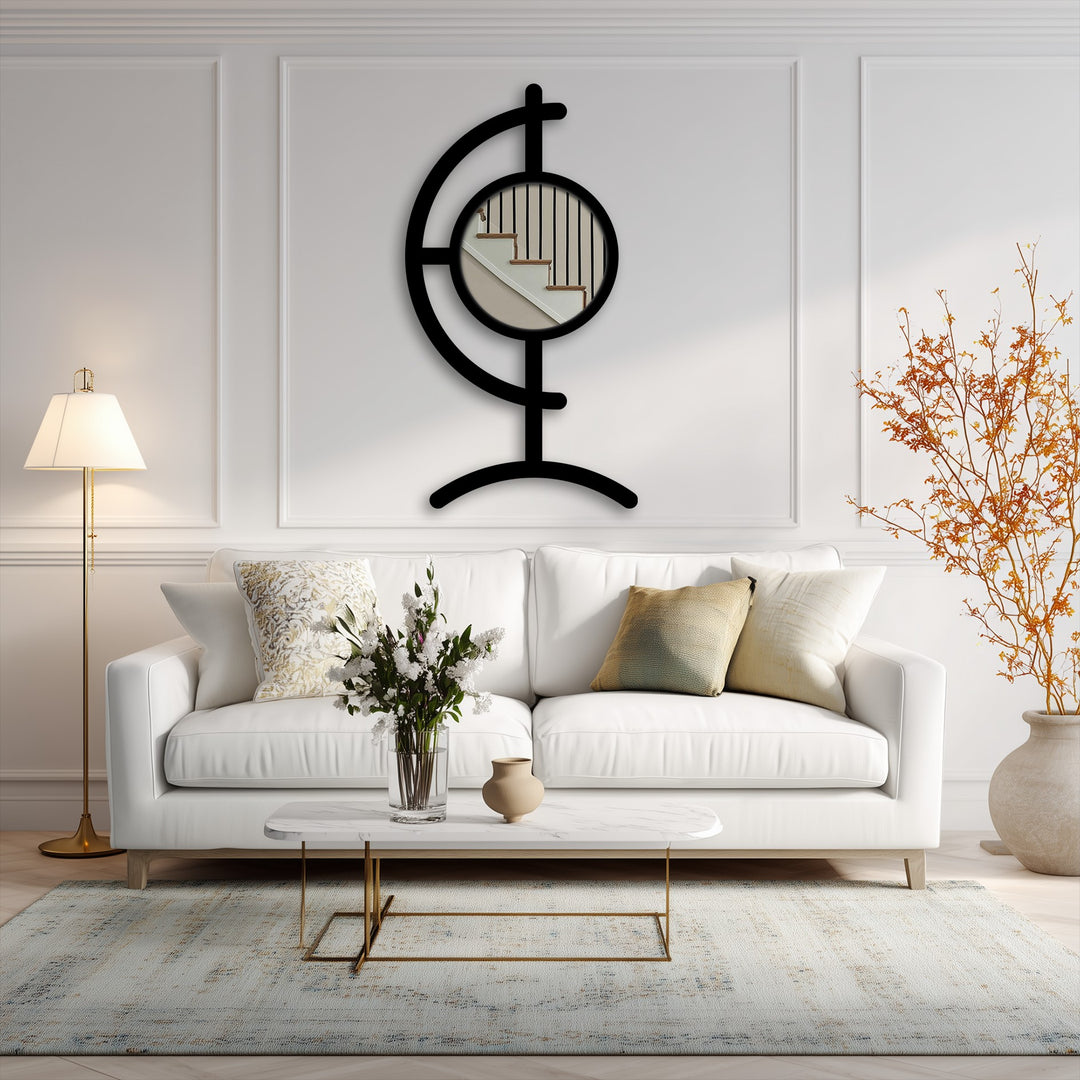 Highlighting the realistic detail, this image displays a sculptural black metal Orbit Line floor mirror for wall decor, showcasing its round center mirror framed by a unique metal design.