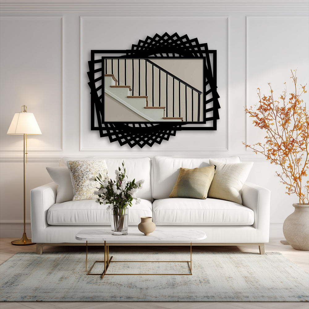 Light and shadow play across the unique metal wall art as a dynamic twist in the mirror's black frame creates a layered design effect.