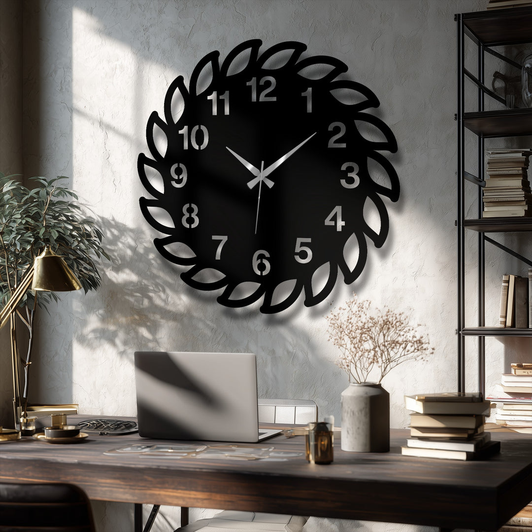 Detailed metal decoration wall art is presented by the bold, black decorative leaf frame wall clock, a striking focal point against a textured wall in the contemporary room.
