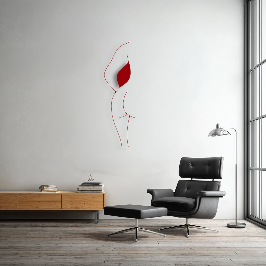 The visual rhythm of the red minimalist female silhouette line art, a striking piece of decorative metal art, creates a fluid flow against the white wall.
