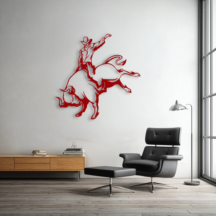 A dynamically oriented and irregularly shaped decorative metal art piece captures the wild rodeo motion of a cowboy bull riding.