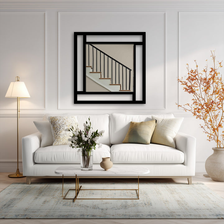 Bold, black geometric lines define the edge and borders of this square metal artwork mirror, a stunning piece among modern wall mirrors.