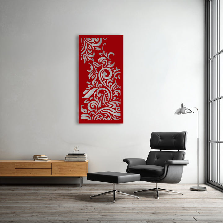 The room has a neutral, cool color temperature, highlighting the striking red and silver ornamental floral unique metal wall art.