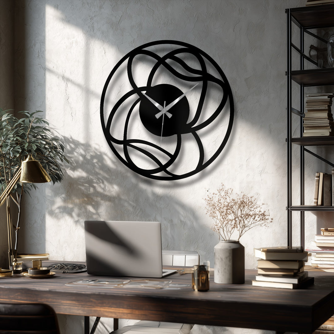 Organic forms intertwine in this metal artwork of a modern, abstract wall clock, creating a geometric decorative piece with interwoven lines and a captivating circular design.