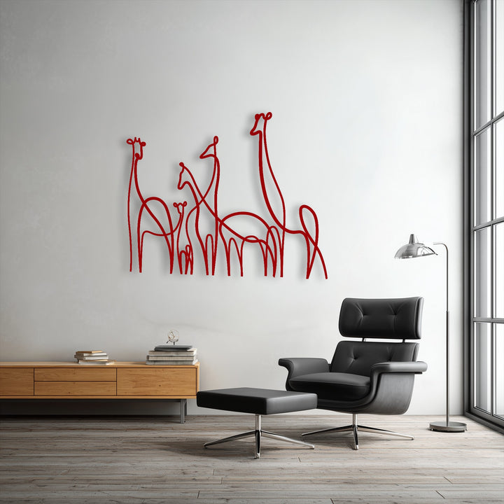 The flowing, interconnected lines of this unique metal wall art capture the dynamic movement of a minimalist giraffe family on a white wall.