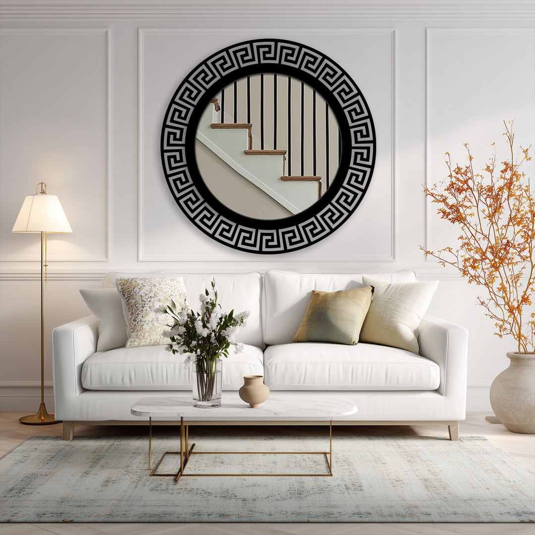 Showcasing a modern black framed geometric Greek key round floor mirror as decorative metal art, serving as the central subject in a stylish home interior.