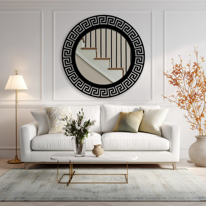 Showcasing a modern black framed geometric Greek key round floor mirror as decorative metal art, serving as the central subject in a stylish home interior.