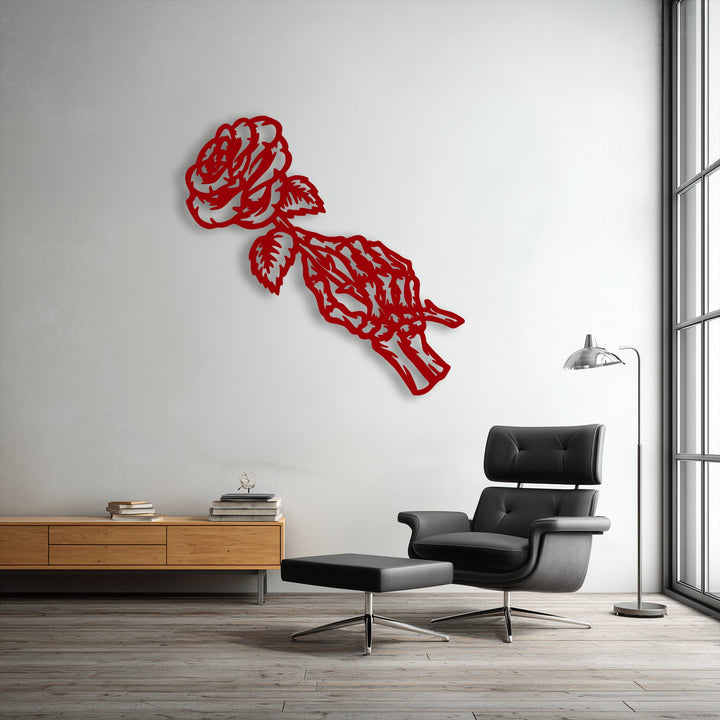 The vibrant crimson Fading Rose Skeleton metal wall decor creates a striking color contrast against the stark white wall.