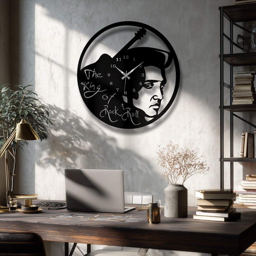 A textured, light-colored wall, dappled with sharp shadows from a window, forms a stylish background for the metal artwork.