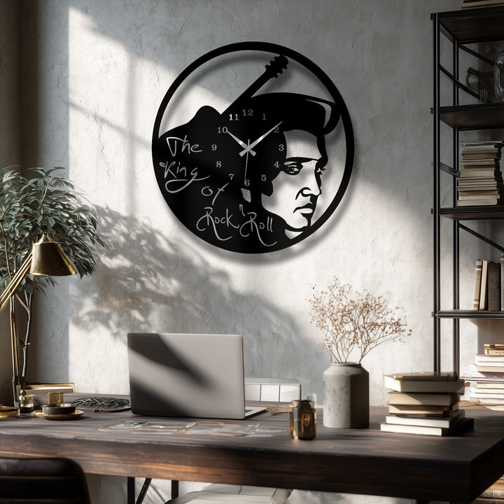 A textured, light-colored wall, dappled with sharp shadows from a window, forms a stylish background for the metal artwork.