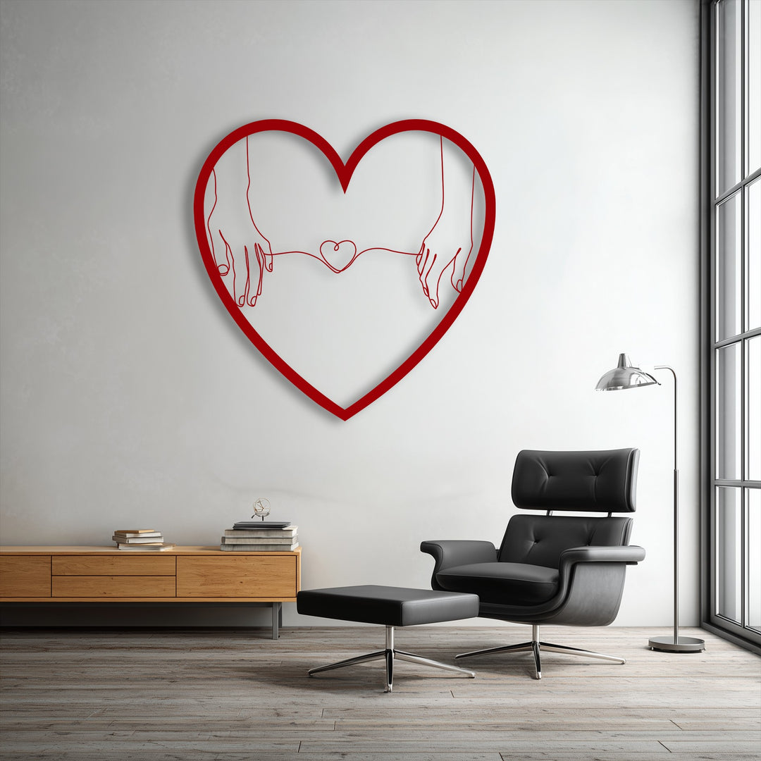 Bold red decorative metal art featuring minimalist connected hearts holding hands, creating a love line design on a white wall.