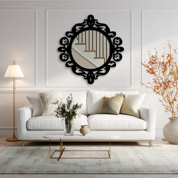 Reflecting a staircase in the ornate royal crest round floor mirror, the black metal frame emphasizes a statement piece of decorative metal art in a stylish living room.