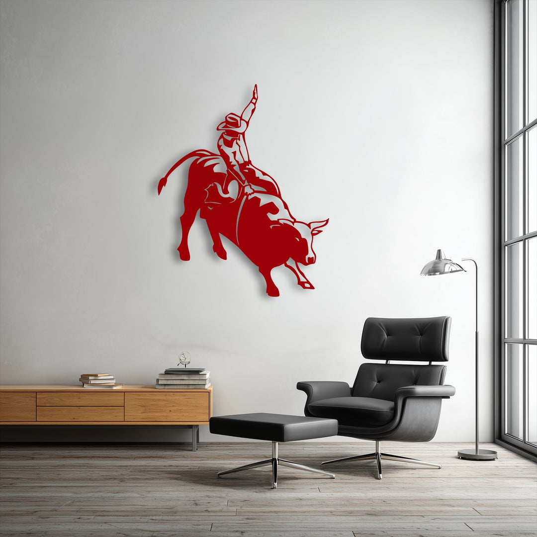 Vibrant red rodeo cowboy on a bucking bull metal artwork adds western action silhouette decor to a modern room.