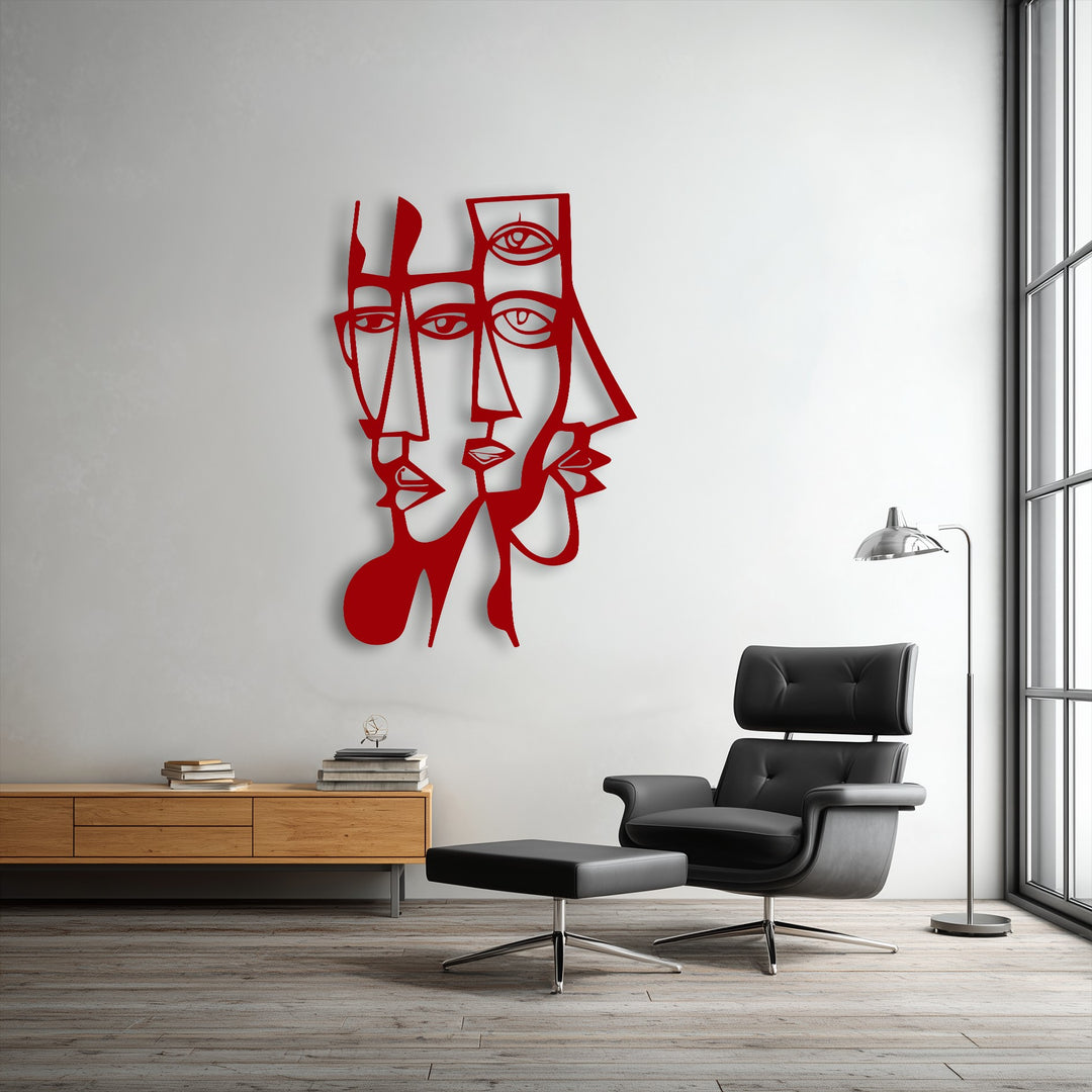 Against the brilliantly white wall, the abstract dual faces decorative metal art with bold geometric lines creates a captivating focal point.