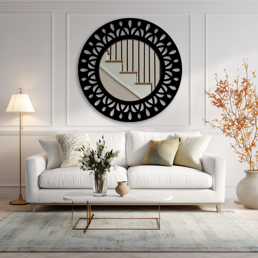 The bright lamp illuminates a sophisticated living room, featuring a striking black leaf motif round metal art for wall reflecting stairs.