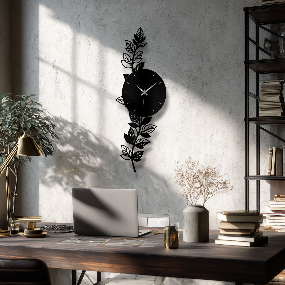 The stillness of the moment highlights the botanical leaf metal art for wall in this elegant wall clock, a modern nature-inspired décor.
