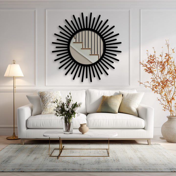 Highlighting the realistic detail, a sunburst round mirror with a black frame serves as an eye-catching example of decorating with wall mirrors in a naturally lit room.