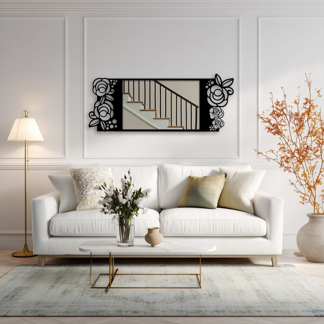 Focusing on the mirror's black metal rose motif, a decoration wall art piece reflecting a staircase adorns a stylish living room.
